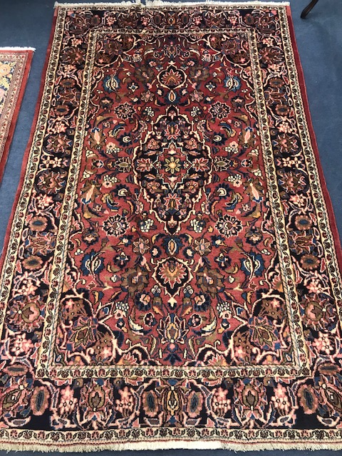 An Araan carpet 204 x 128cm